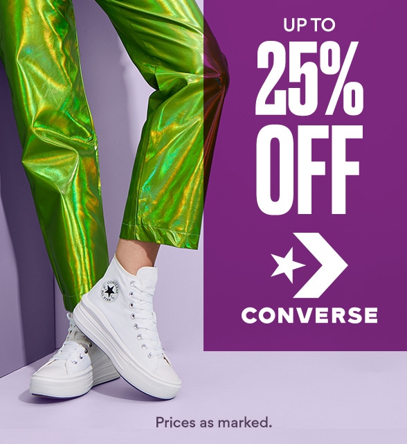 up to 25% off converse. woman in green pants wearing white high top converse sneakers
