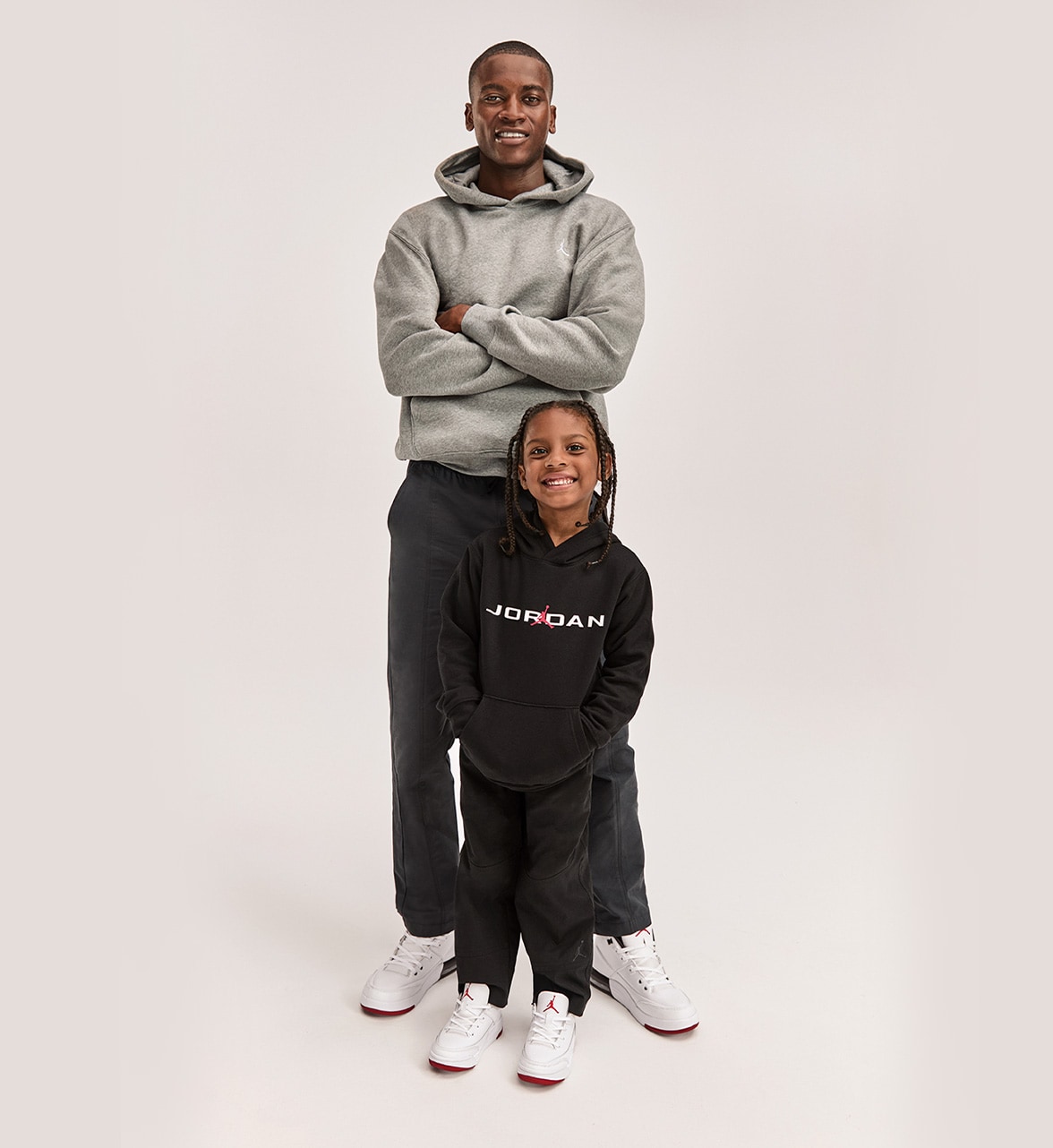 man and boy wearing Jordan sneakers