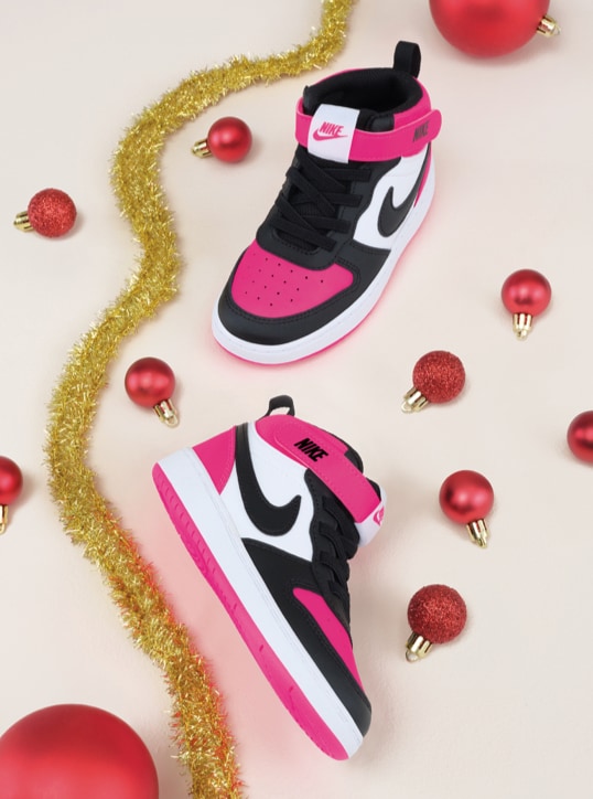 black, pink and white Nike court sneakers