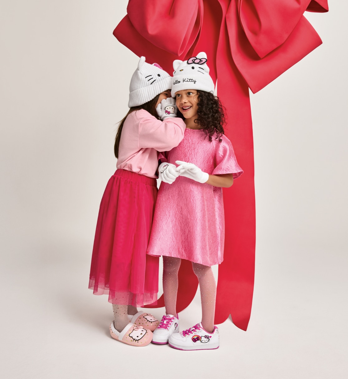 2 young girls wearing fun sneakers for the Holidays