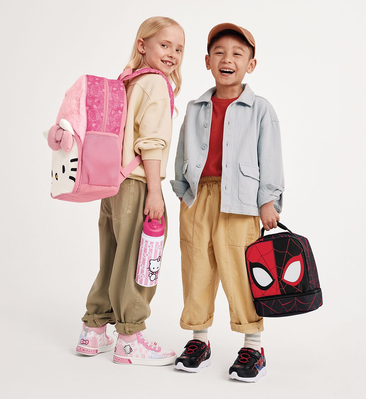 kids wearing backpacks and lunchboxes for back to school 2026