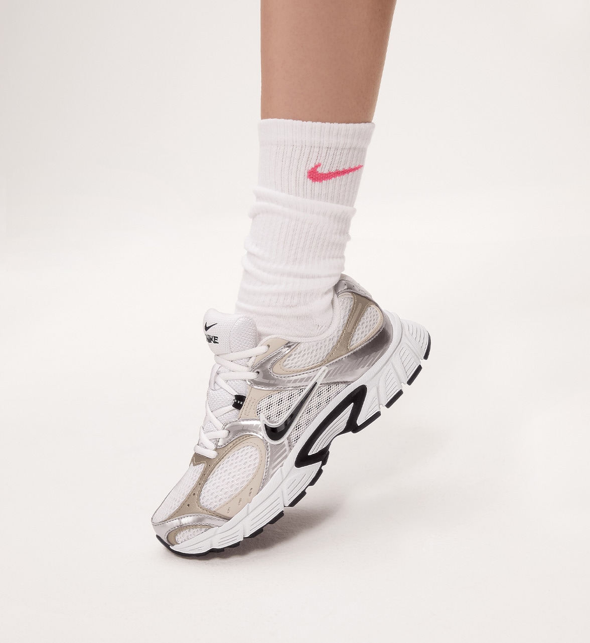 beige and white Nike V5RNR